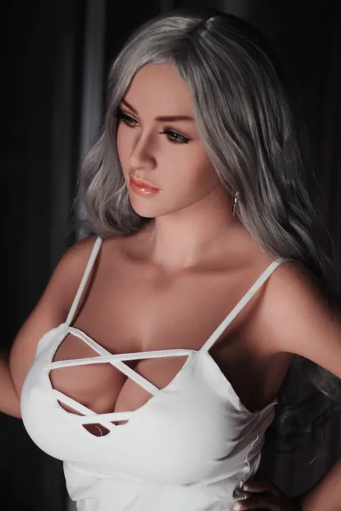 Woman with Enhanced Tits Peels Off Her Top and Poses Nude – photo 17 of 21
