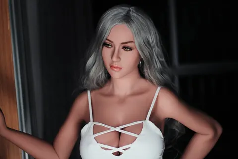 Woman with Enhanced Tits Peels Off Her Top and Poses Nude – photo 15 of 21