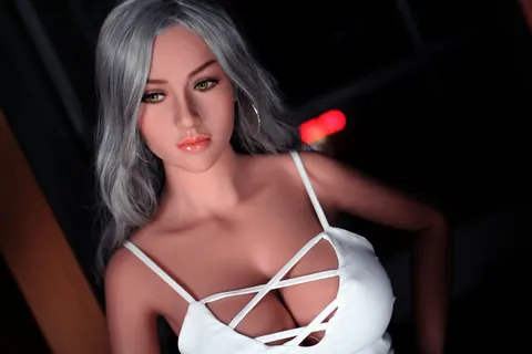 Woman with Enhanced Tits Peels Off Her Top and Poses Nude – photo 7 of 21