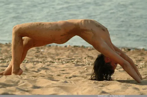 Slim Tanned Brunette Strips Nude on the Beach – photo 12 of 20