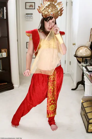 Asian MILF Undresses and Poses Nude for the Archives