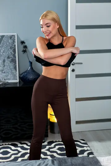 Petite European Blonde Undresses and Arches Nude
