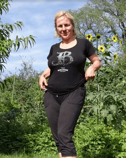 Busty Blonde MILF with Short Hair Poses in a Skirt Outdoors – photo 7 of 20