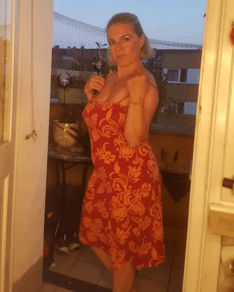 Busty Blonde MILF with Short Hair Poses in a Skirt Outdoors – photo 9 of 20