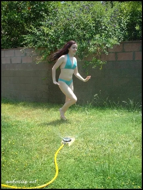 Amber Lily: Thick Brunette MILF Wets Her Bikini with a Garden Hose – photo 11 of 15