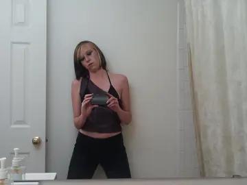 Skinny Amateur Strips to Her Panties for a Mirror Selfie