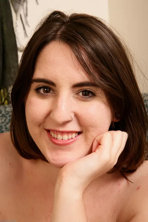 Beryl Aspen: Busty Brunette Reveals Her Hairy Bush and Tattoos on the Sofa – photo 20 of 20
