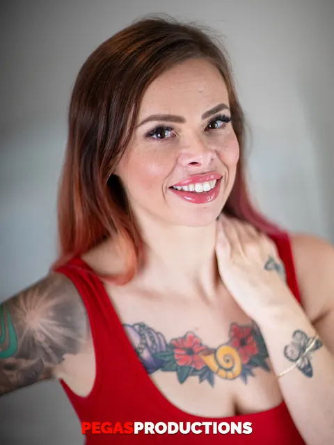 Tattooed MILF Undresses from Red Dress and Shows Her Big Tits – photo 3 of 18