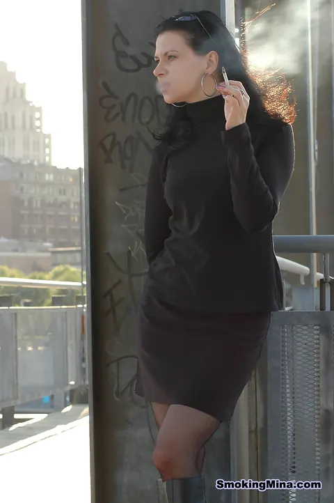 Mature Brunette MILF Lights Cigarette in Stockings and Skirt Outdoors – photo 15 of 16