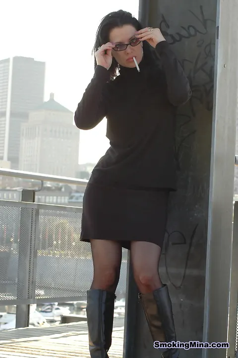 Mature Brunette MILF Lights Cigarette in Stockings and Skirt Outdoors – photo 10 of 16