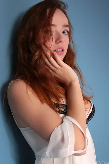 Ukrainian Redhead in Lingerie and Stockings Shows Off Her Natural Tits