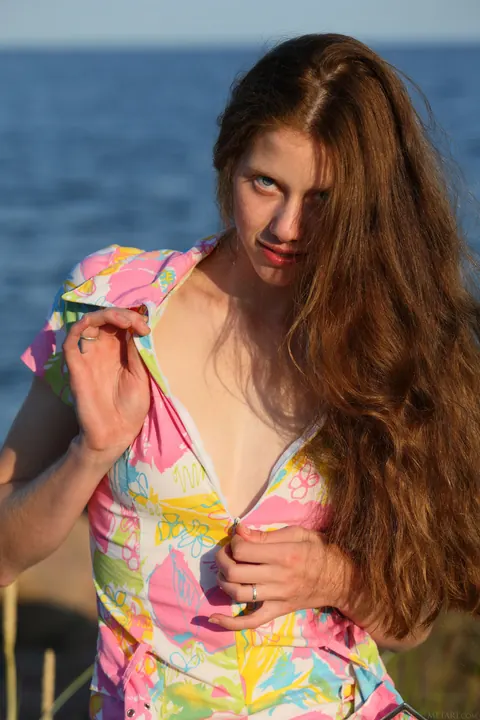 Thick Redhead in a Skirt and Panties Spreads on the Beach – photo 4 of 21