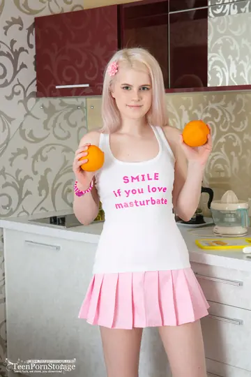 Blonde in a Skirt Fingers and Spreads Her Pussy in the Kitchen