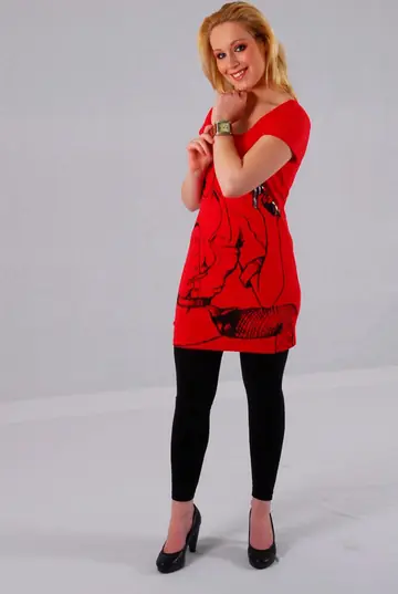 Blonde in High Heels and Skirt Poses for the Gallery