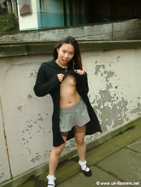 Tigerr Benson: Thick Asian MILF Poses in a Skirt on a Public Sidewalk – photo 2 of 12