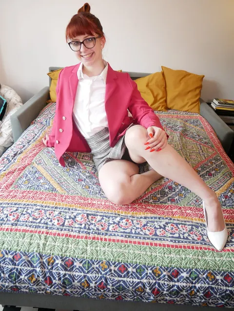 Redhead in a Skirt and Glasses Spreads Her Legs to Show Panties – photo 14 of 14