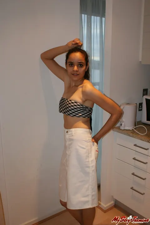 Jasmine Mathur: Asian Brunette in a Skirt and Top Shows Her Bare Feet – photo 9 of 11