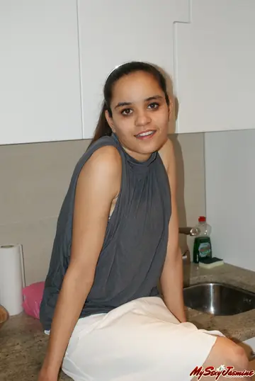 Asian Brunette in a Skirt and Top Shows Her Bare Feet