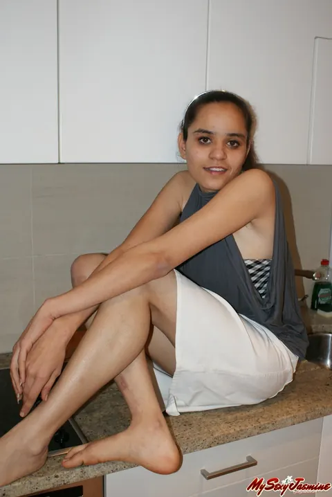 Jasmine Mathur: Asian Brunette in a Skirt and Top Shows Her Bare Feet – photo 2 of 11