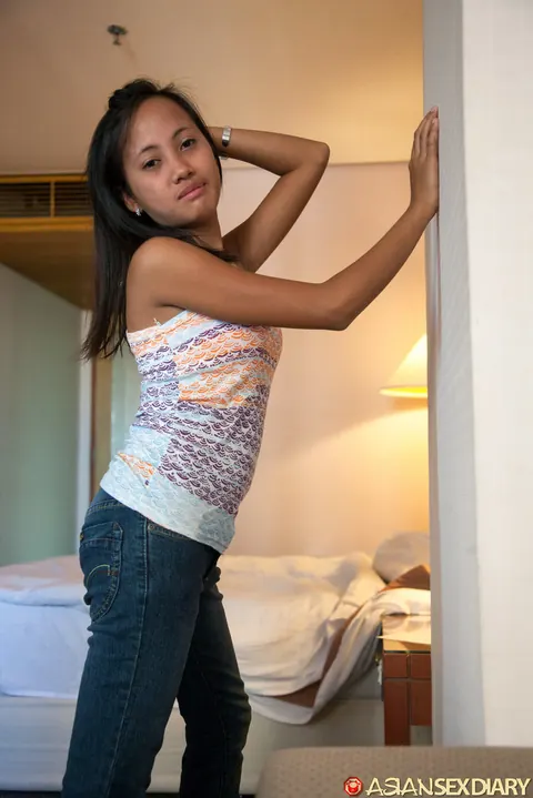 Petite Asian Woman Strips Nude and Poses for the Camera – photo 9 of 20
