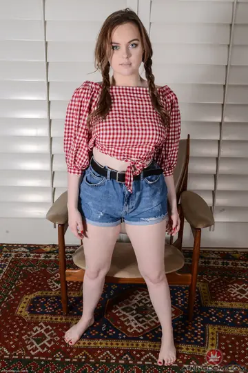 Petite Redhead in Pigtails Shows Her Big Tits and Spreads