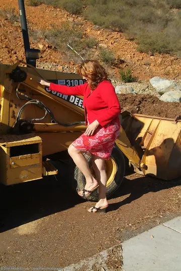 Marishka – Curvy Mature Redhead Flaunts Her Big Tits on a Tractor
