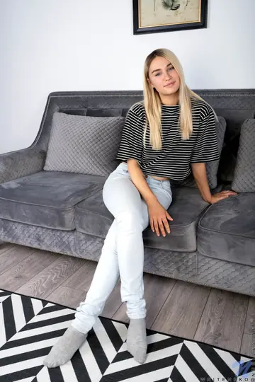 Cute Teddy – Blonde Strips Out of Her Jeans and Shows Her Shaved Pussy on the Sofa