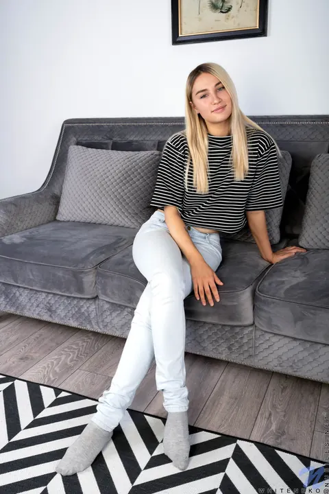 Cute Teddy: Blonde Strips Out of Her Jeans and Shows Her Shaved Pussy on the Sofa – photo 1 of 16