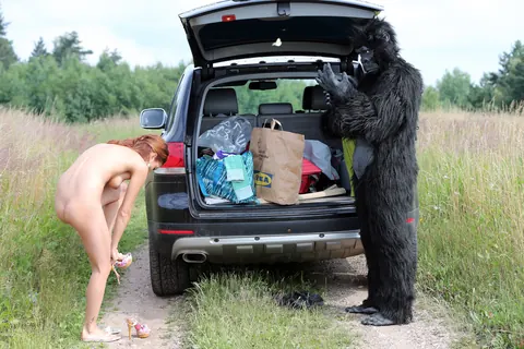 Woman Kisses and Fucks Gorilla-Suited Man Outdoors – photo 14 of 20