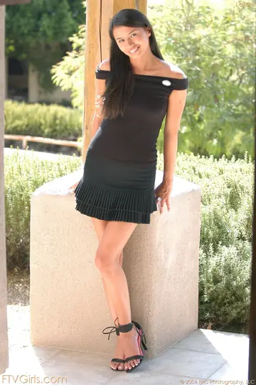 Woman in a Skirt and Panties Spreads Outdoors Showing Her Pierced Nipples