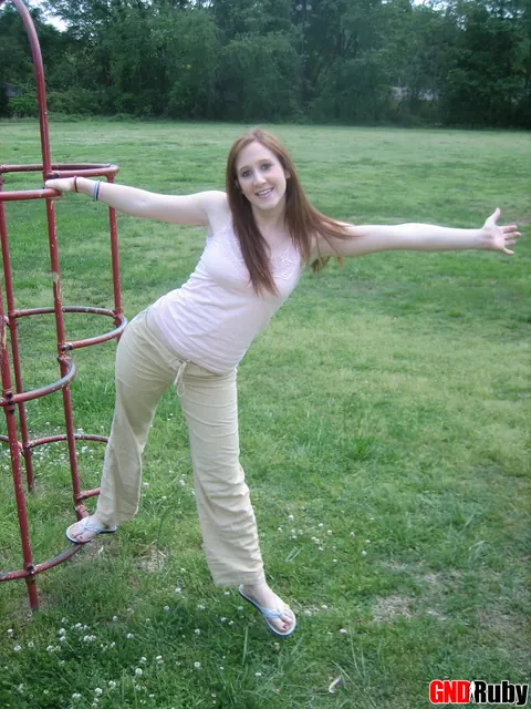 Redhead Bares Her Breasts and Spreads on Playground – photo 11 of 12