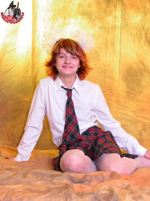 Redhead Strips Out of Her Uniform and Stockings – photo 4 of 17