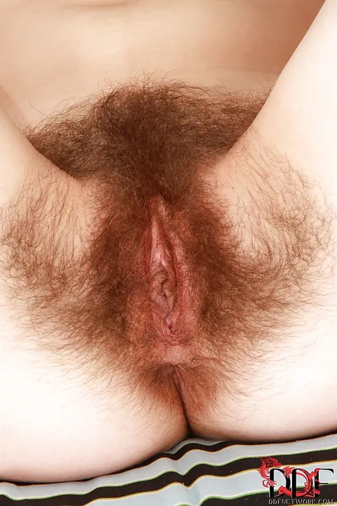 Curly Blonde in Glasses Undresses and Spreads Her Hairy Pussy – photo 10 of 16