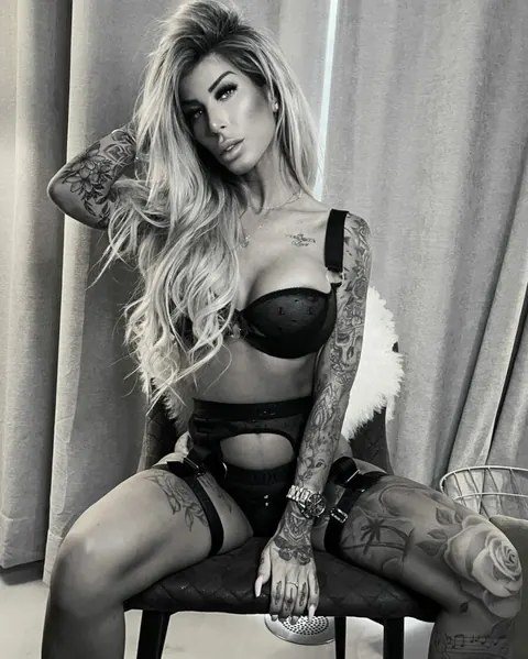 Blonde with Big Tits Shows Her Tattoos in Lingerie – photo 2 of 14