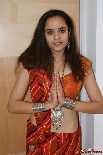 Indian Brunette in a Skirt and Panties Reveals Her Natural Tits