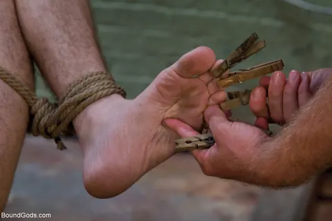 Two Naked Men in Bondage Play with a Dildo – photo 10 of 21