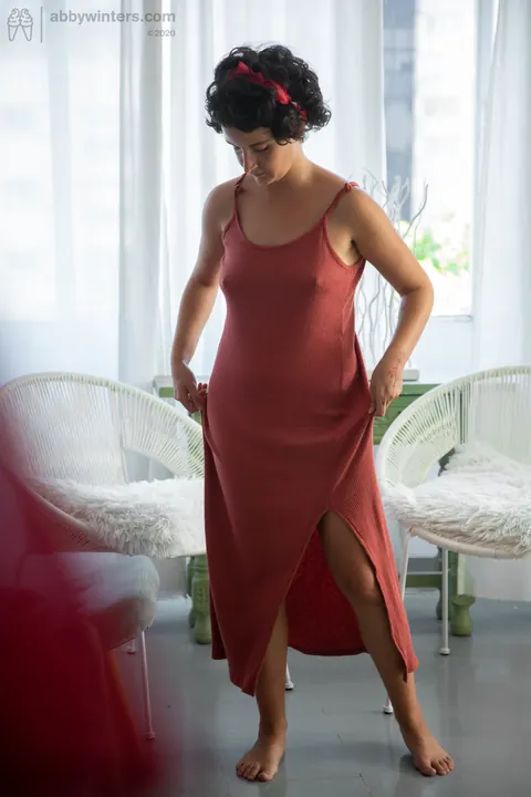 Curly Brunette Lifts Her Red Dress to Show Panties – photo 19 of 21