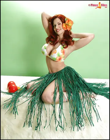 Redhead Flaunts Her Big Enhanced Tits in a Bikini