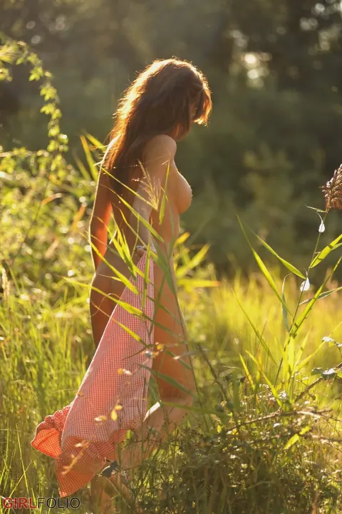 Redhead with Big Tits Strips Nude and Poses on Mossy Ground – photo 12 of 12