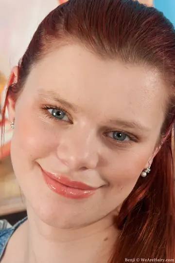 Redhead Frees Her Natural Tits and Fingers Her Hairy Pussy
