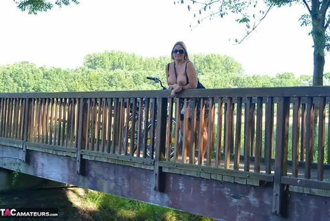 Nudechrissy: Mature European Blonde Rides a Bicycle Topless in a Skirt Outdoors – photo 19 of 20