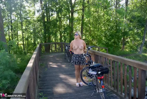 Nudechrissy: Mature European Blonde Rides a Bicycle Topless in a Skirt Outdoors – photo 20 of 20