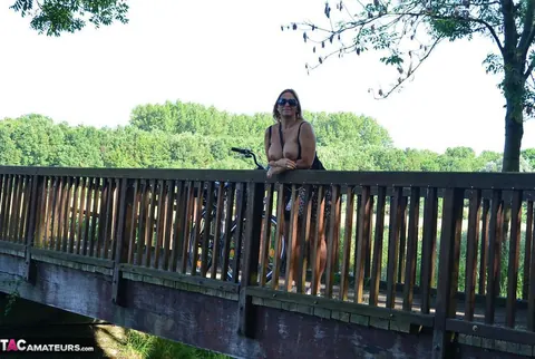 Nudechrissy: Mature European Blonde Rides a Bicycle Topless in a Skirt Outdoors – photo 17 of 20