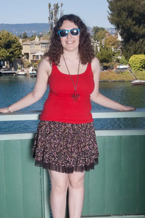 Chubby Curly Brunette in a Bikini Strips and Spreads Outdoors – photo 1 of 21