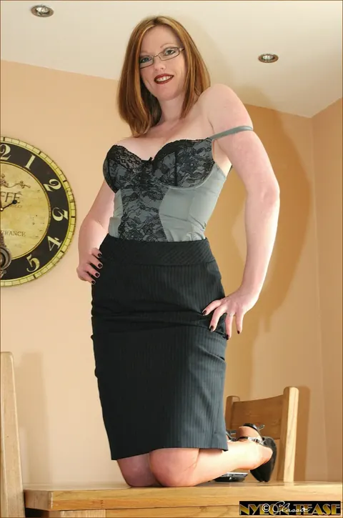 Holly Kiss: Redhead MILF in Lingerie and Glasses Poses in the Office – photo 7 of 15