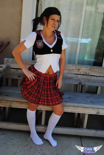 Thick Brunette in Uniform Skirt and Stockings Plays with a Dildo