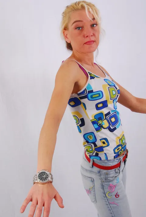 Blonde MILF Poses in Jeans Wearing a Huge Metal Watch – photo 1 of 16