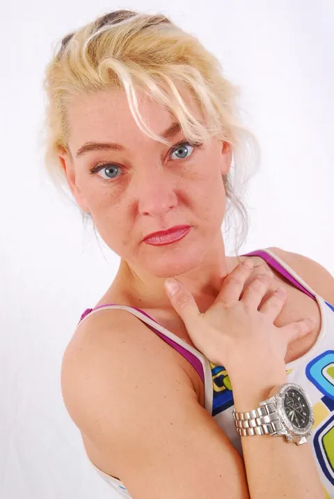 Blonde MILF Poses in Jeans Wearing a Huge Metal Watch – photo 2 of 16