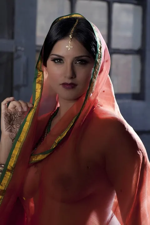 Sunny Leone: Busty Indian MILF Strips Out of Her See-Through Attire – photo 12 of 15