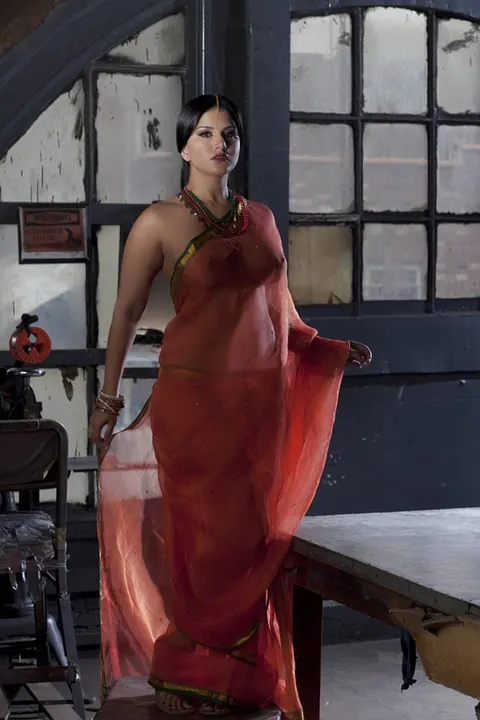 Sunny Leone: Busty Indian MILF Strips Out of Her See-Through Attire – photo 1 of 15